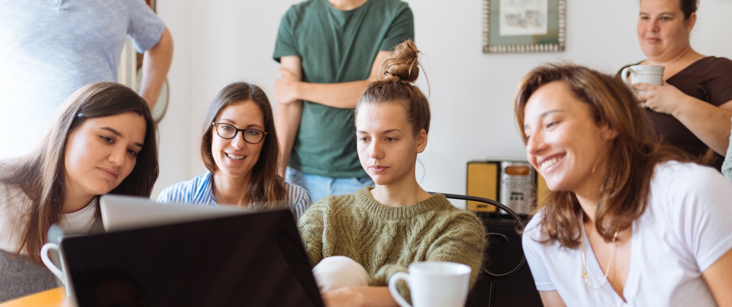 people looking at laptop computer 1595391